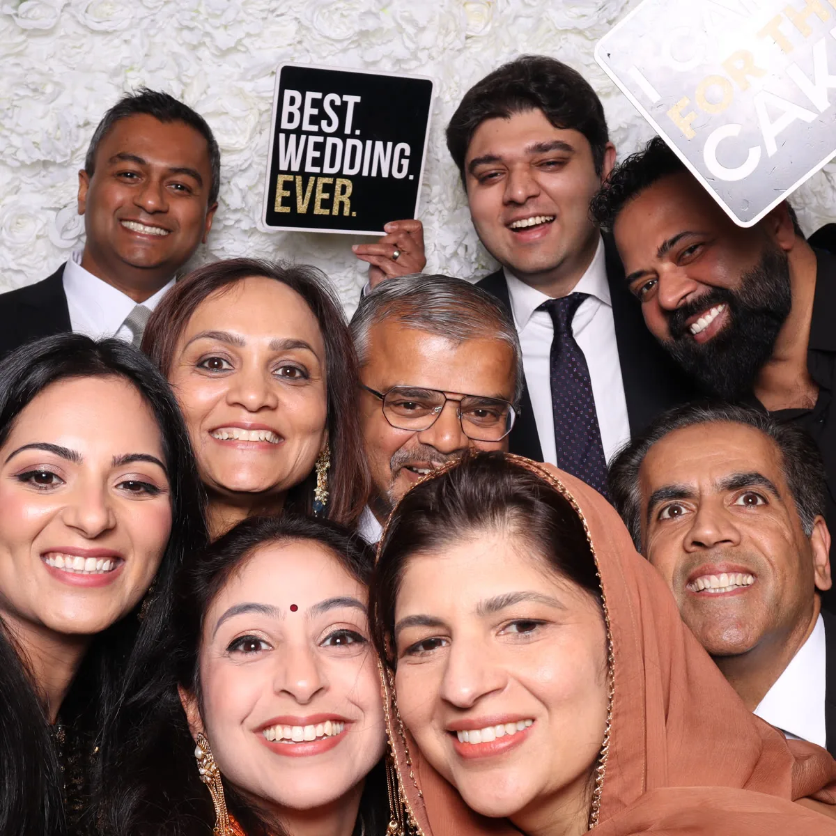 Clutch City luxury photo booth with flower wall at Houston wedding reception